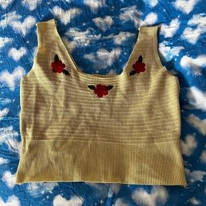 White knitted vest with red flower pattern